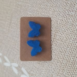 Blue butterfly stud earrings.